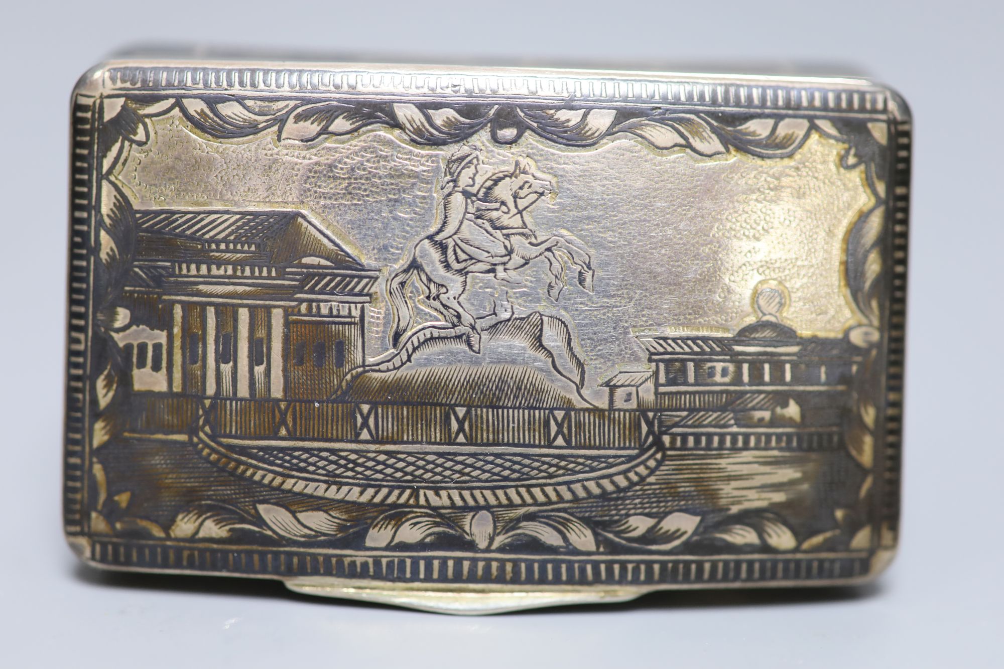 A 19th century Russian 84 zolotnik and niello concave snuff box, dated 1836, 64mm, gross 59 grams,
